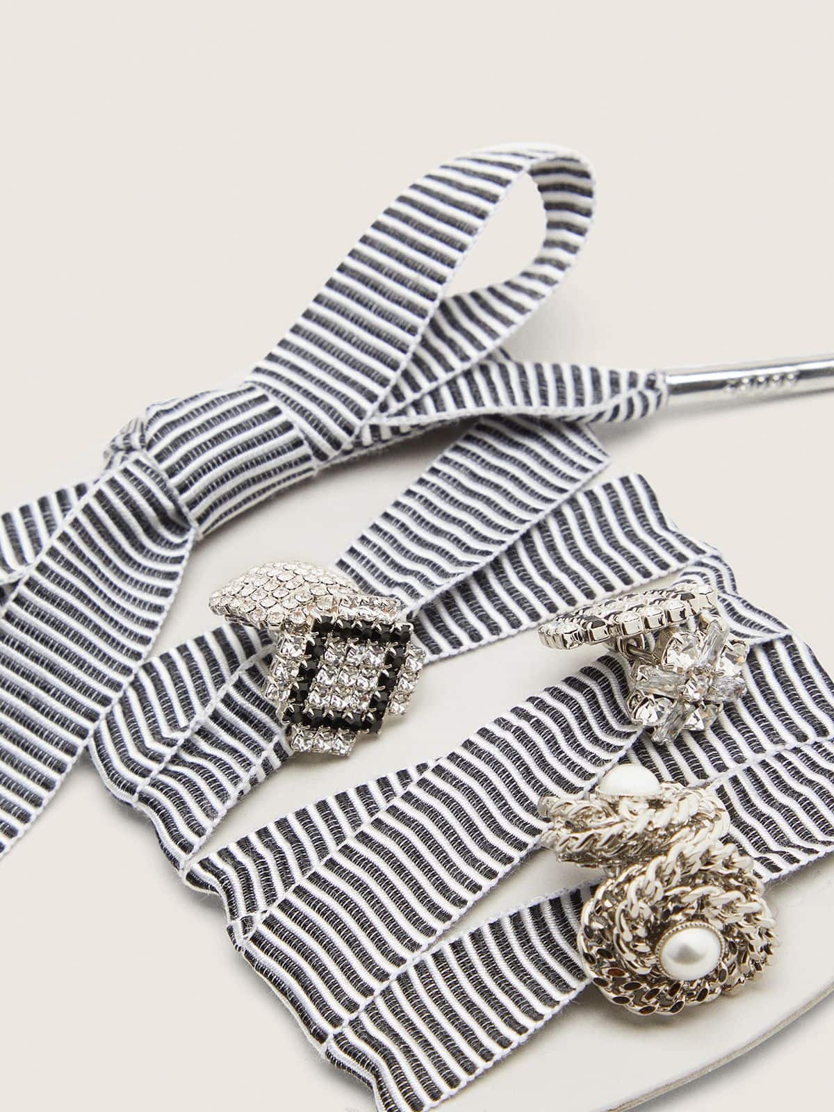 Skins striped laces embellished with charms