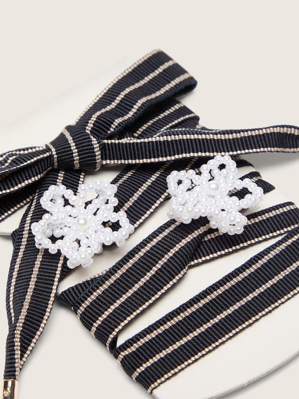 Skins white and dark blue striped laces with beaded charms