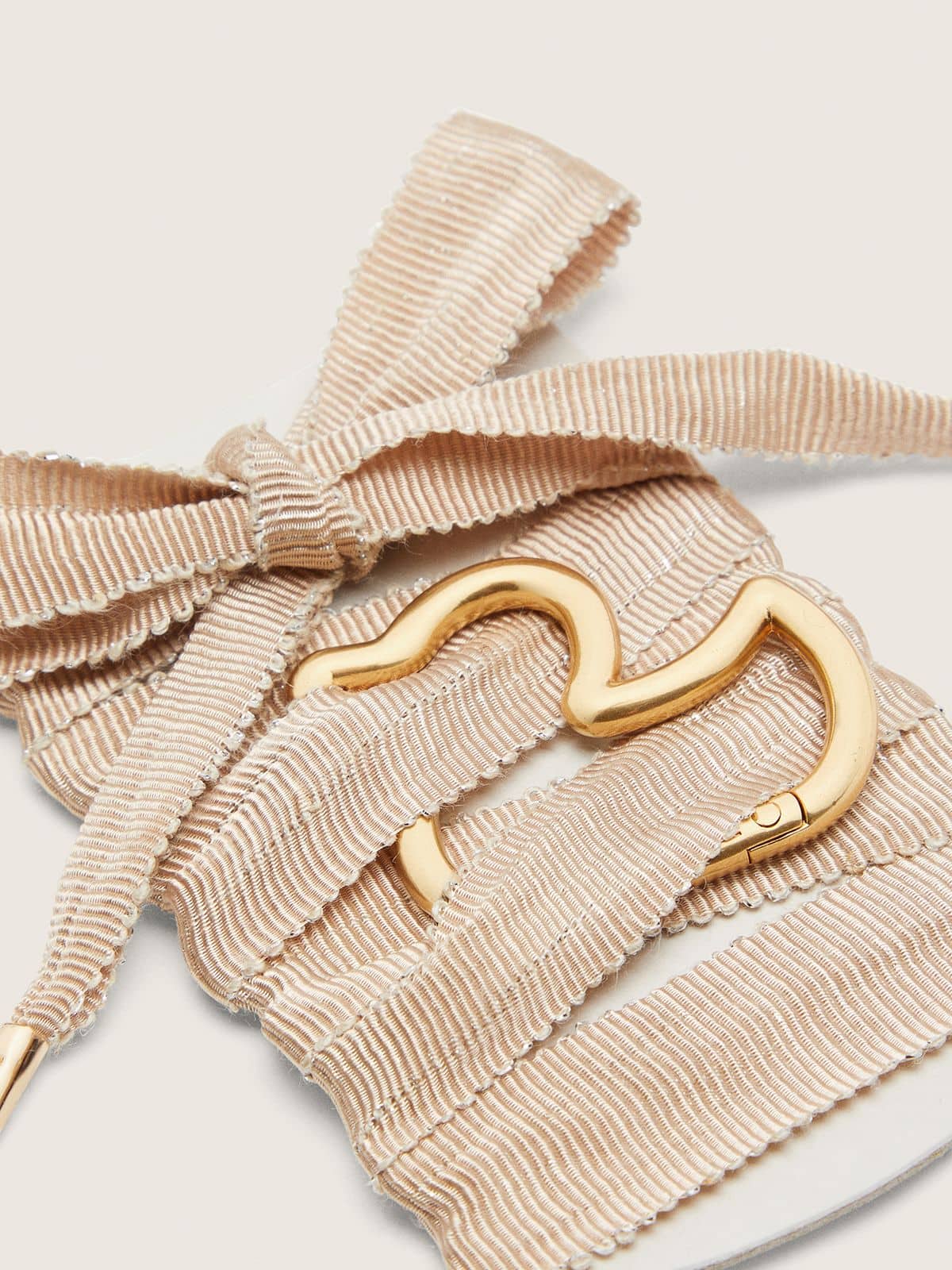 Skins beige laces with gold duck-shaped snap hook