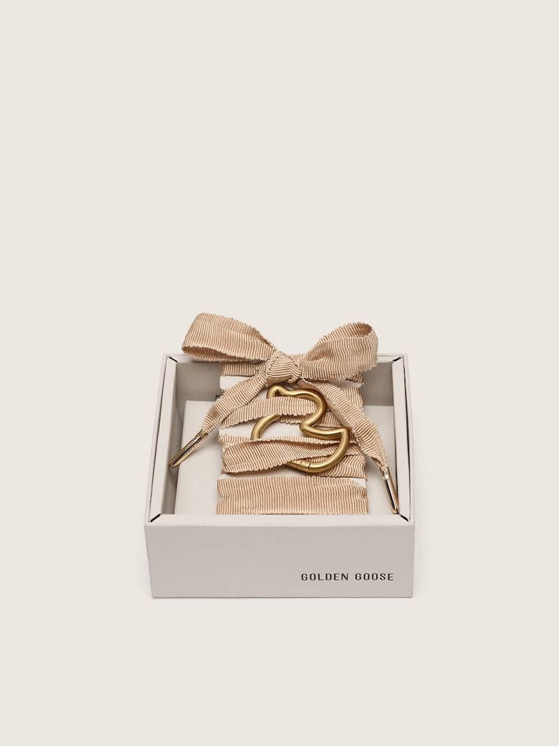 Skins beige laces with gold duck-shaped snap hook