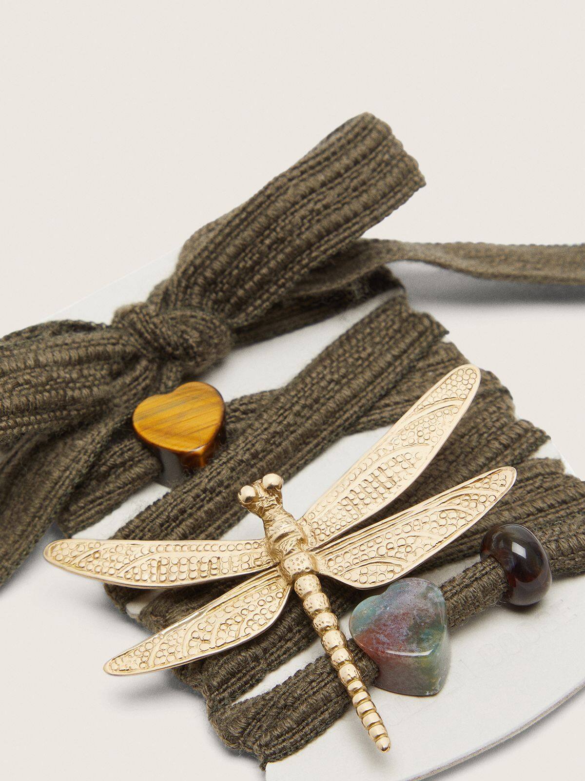Skins dark green laces with dragonfly charm
