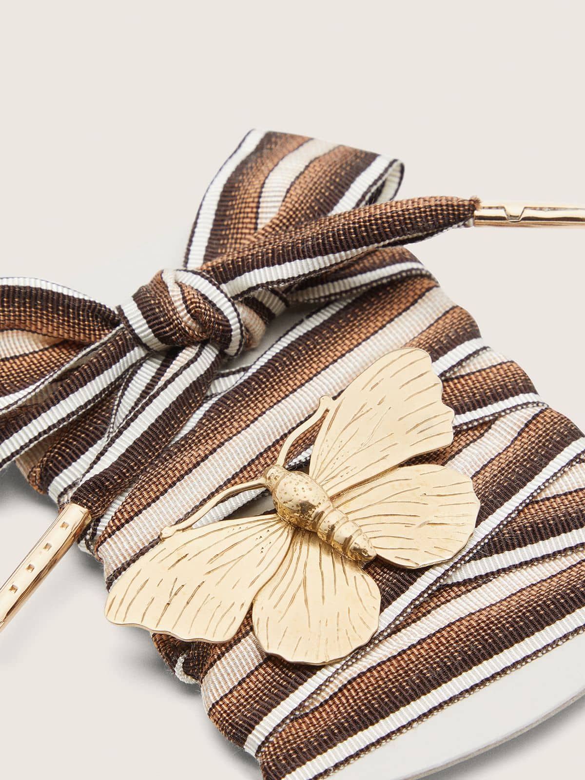 Skins multicolor laces with butterfly charm