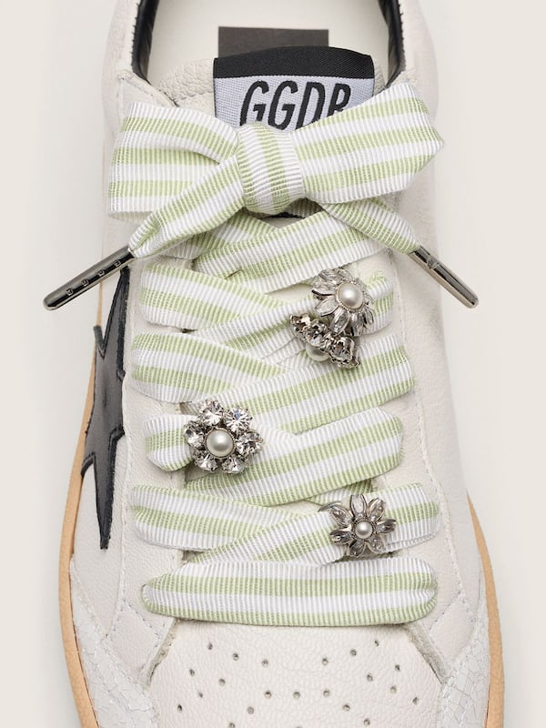 Skins green and white striped laces with jewel charms