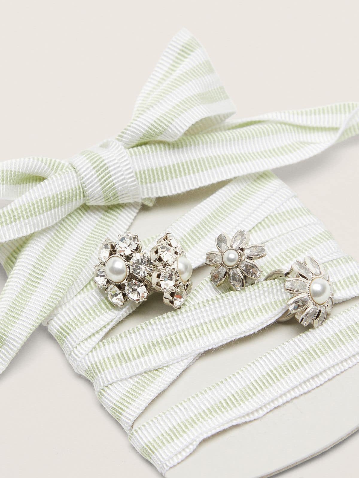 Skins green and white striped laces with jewel charms