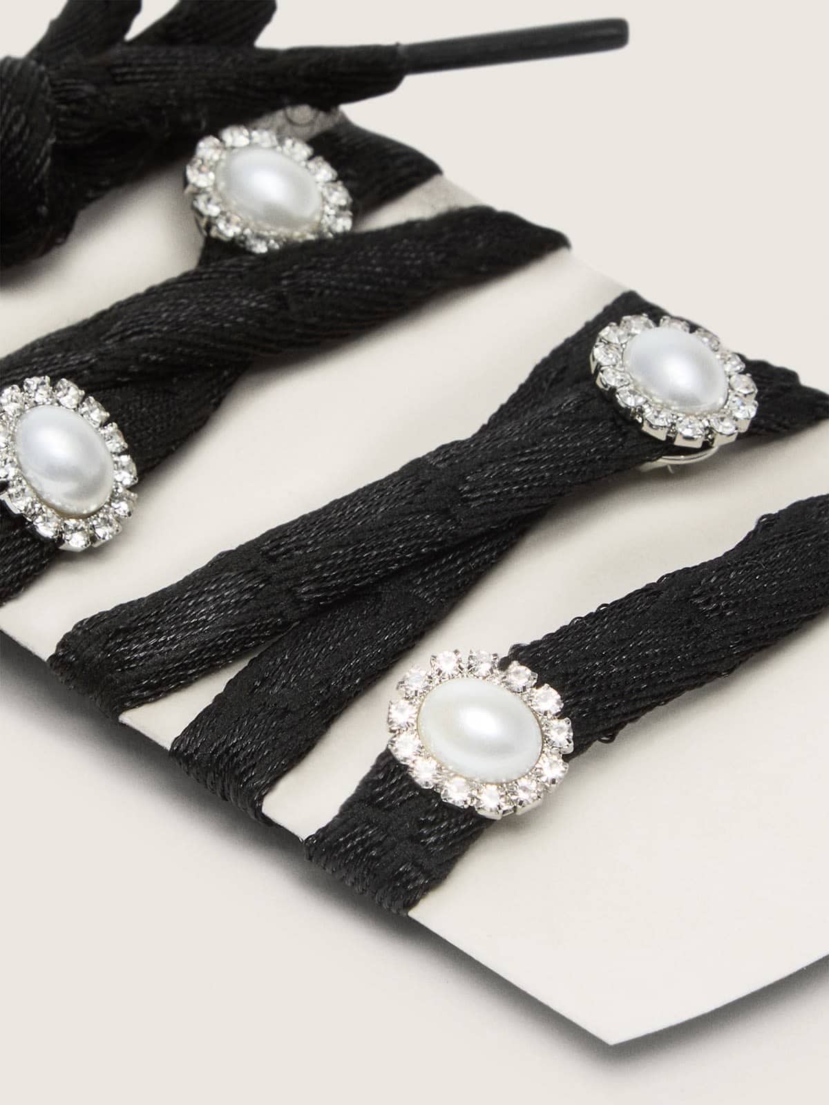 Skins black laces with pearl charms