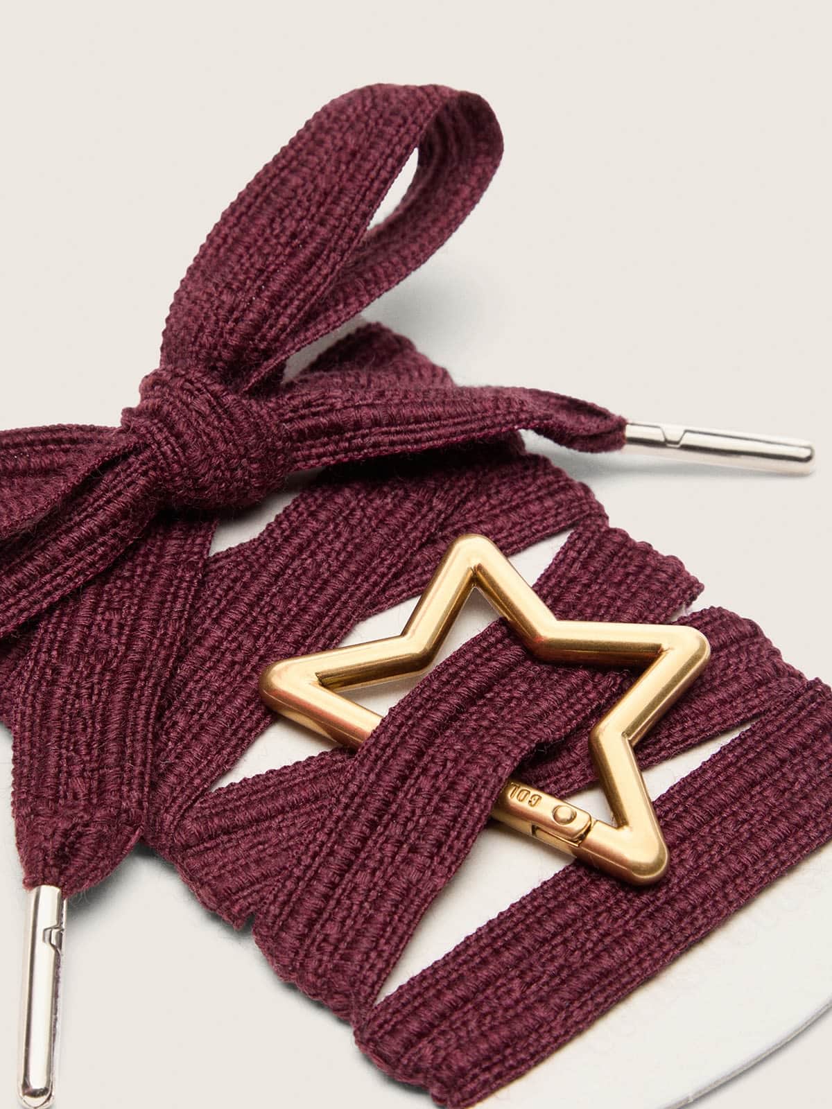 Skins burgundy embroidered laces with star-shaped snap hook
