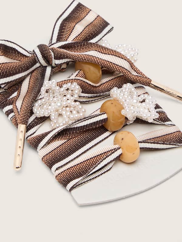 Skins brown striped laces with flower-shaped bead appliqu&eacute;s