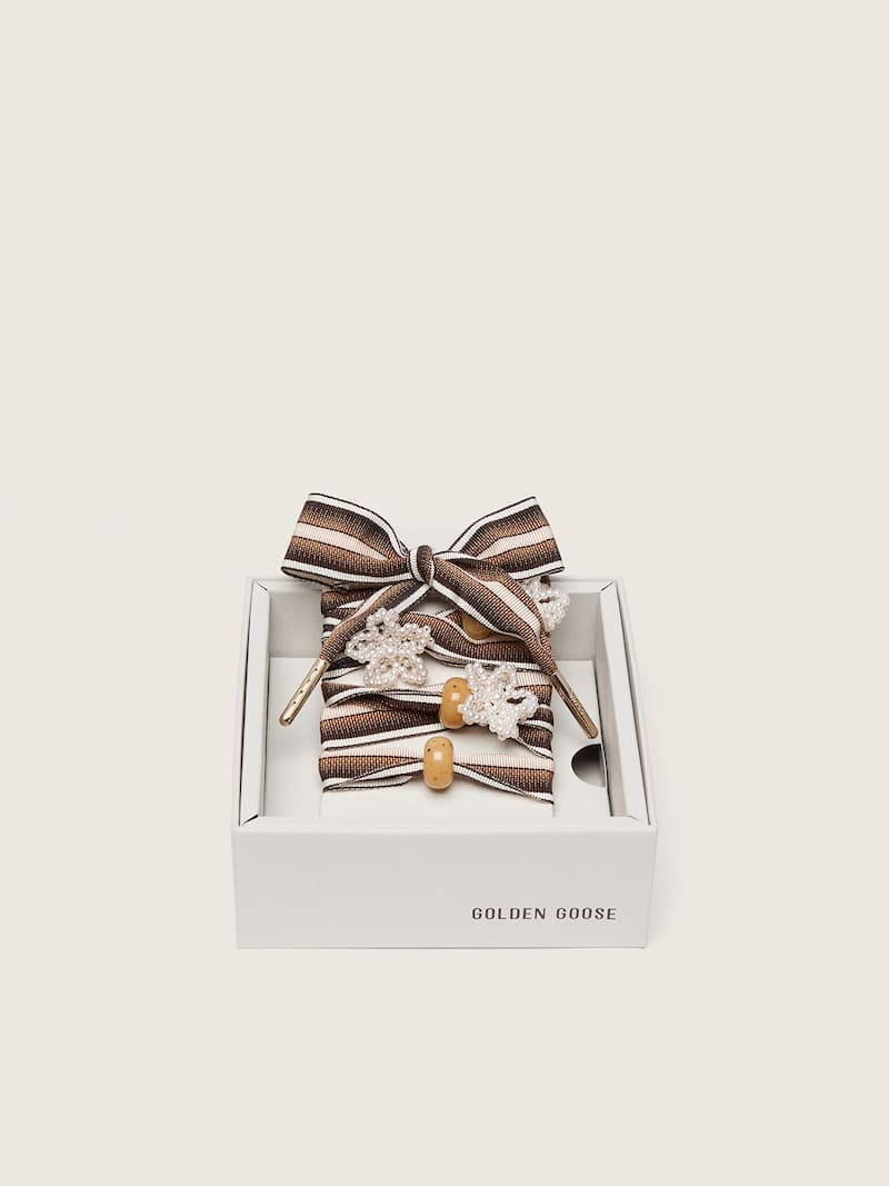 Skins brown striped laces with flower-shaped bead appliqu&eacute;s