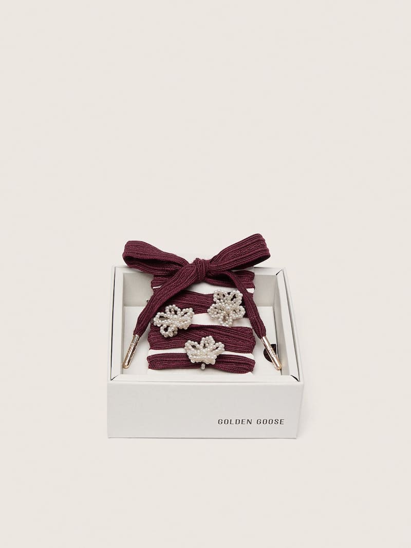 Skins burgundy wool laces with three flower-shaped bead appliqu&eacute;s
