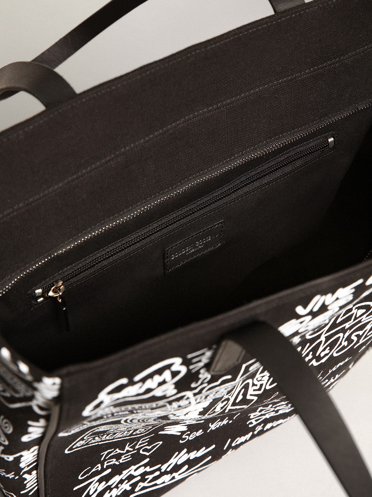 Golden Goose - Black North-South California Bag with contrasting white graffiti print in 