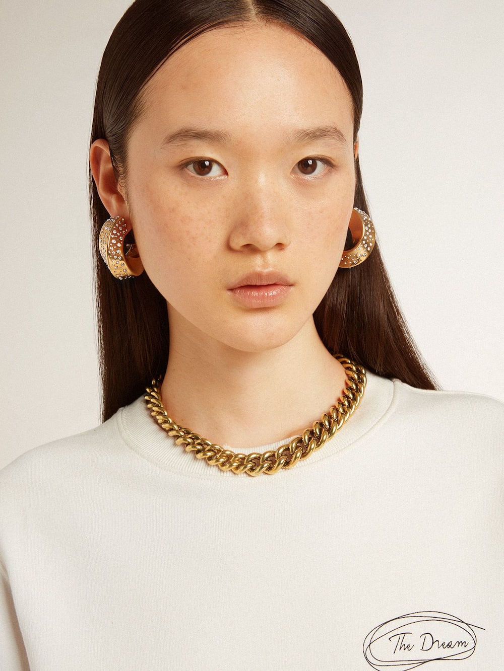 Necklace in antique gold decreasing chain with star-shaped clasp ...