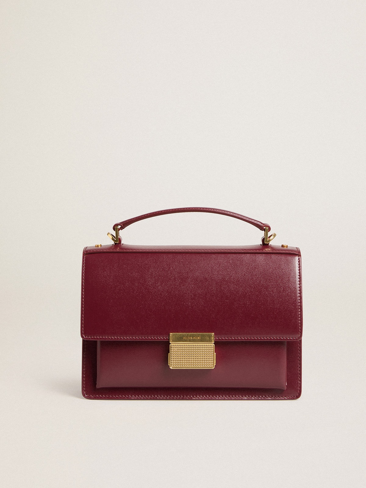 Golden Goose - Venezia Bag in burgundy boarded leather with gold details in 