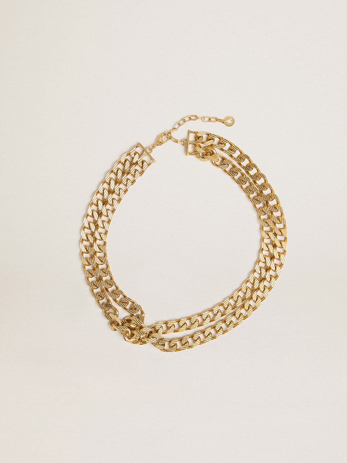 Golden Goose - Antique gold-colored braided chain necklace with star-shaped clasp in 