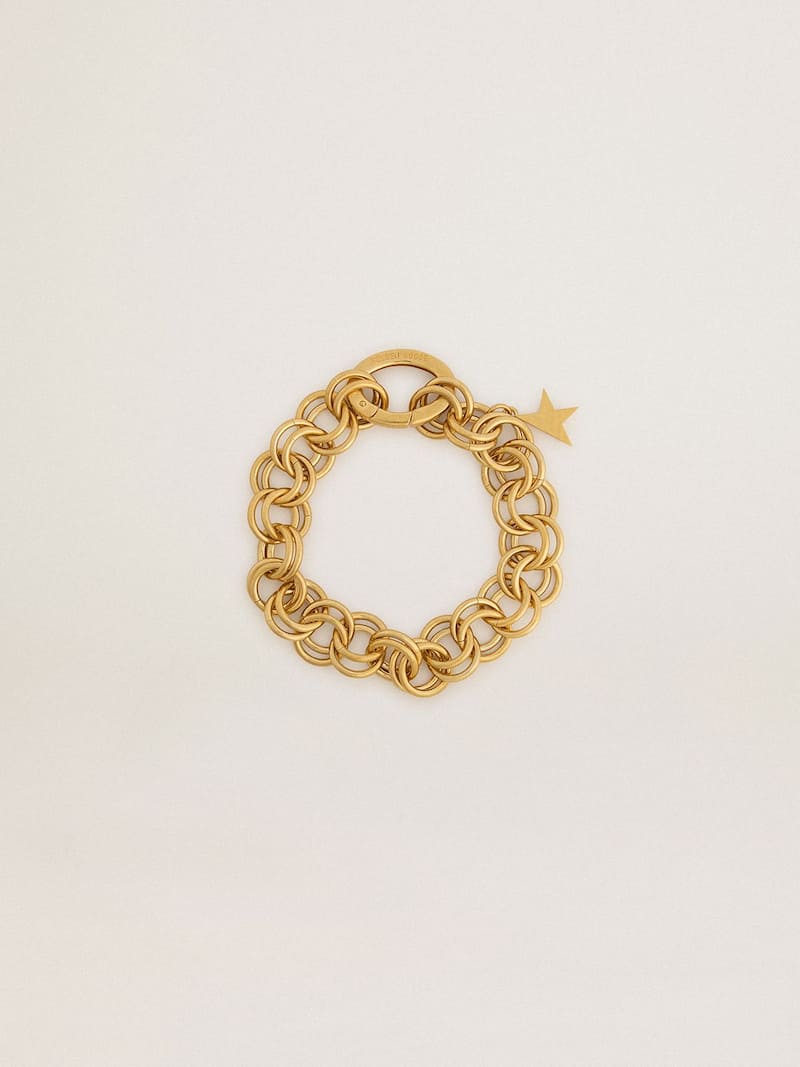 Antique gold-colored woven chain bracelet with star-shaped clasp