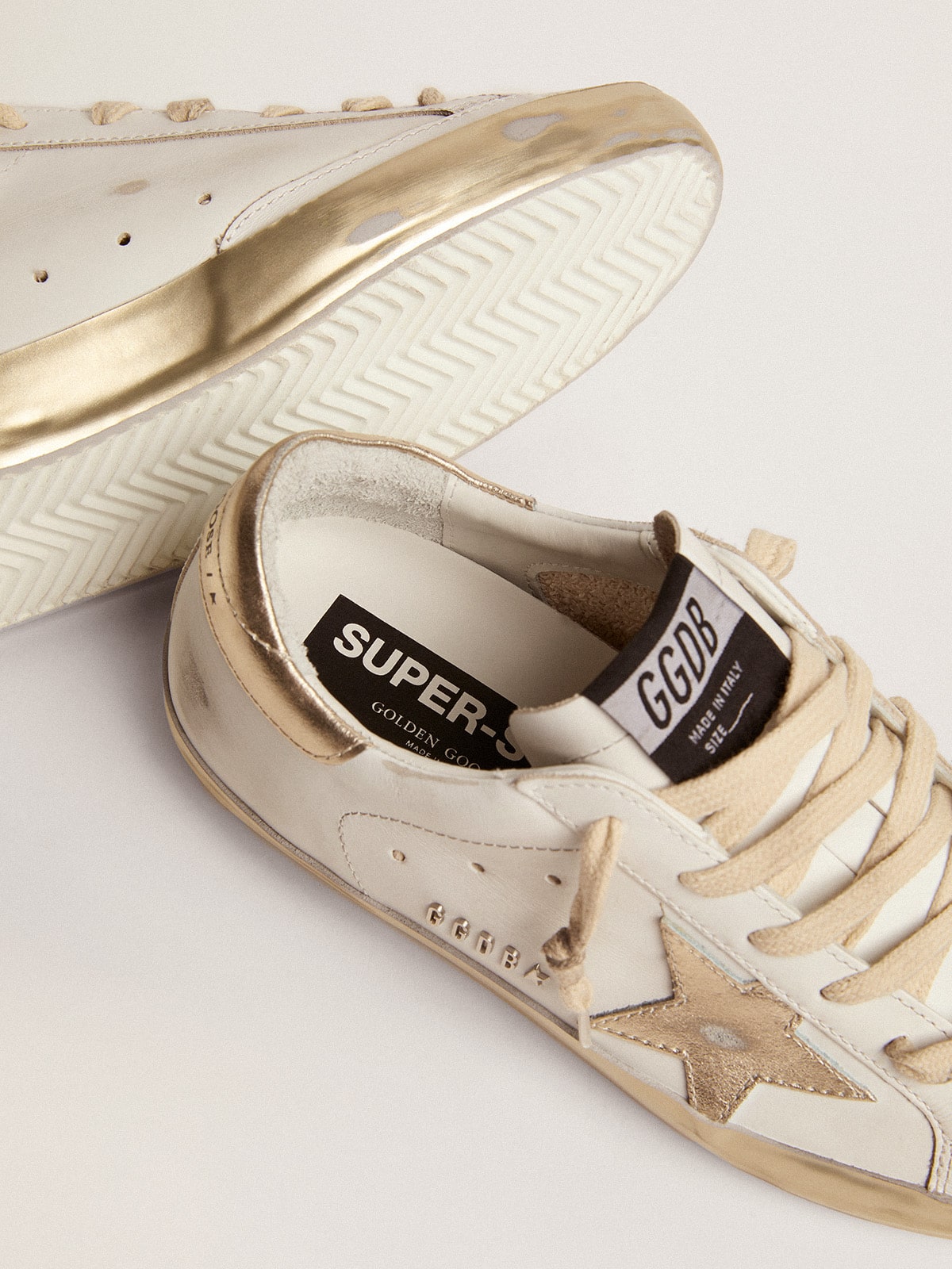 Golden Goose - Women's Super-Star with gold sparkle foxing and metal stud lettering in 