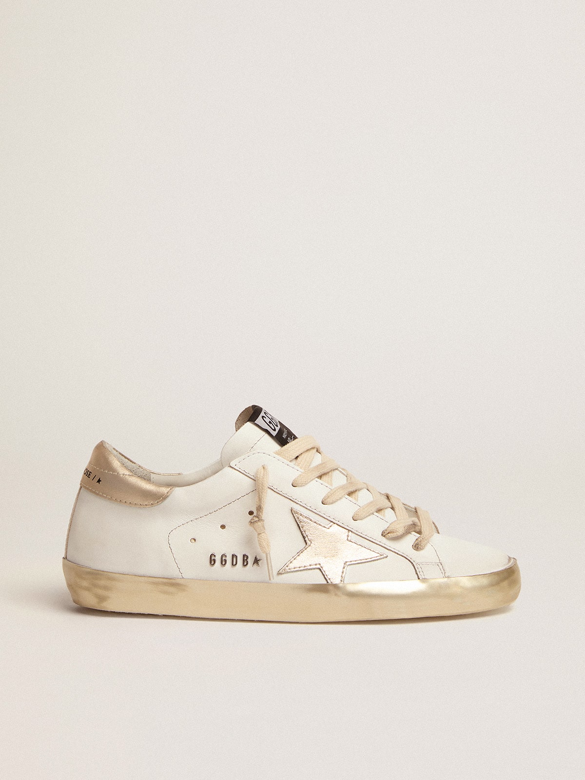 Golden Goose - Women's Super-Star with gold sparkle foxing and metal stud lettering in 