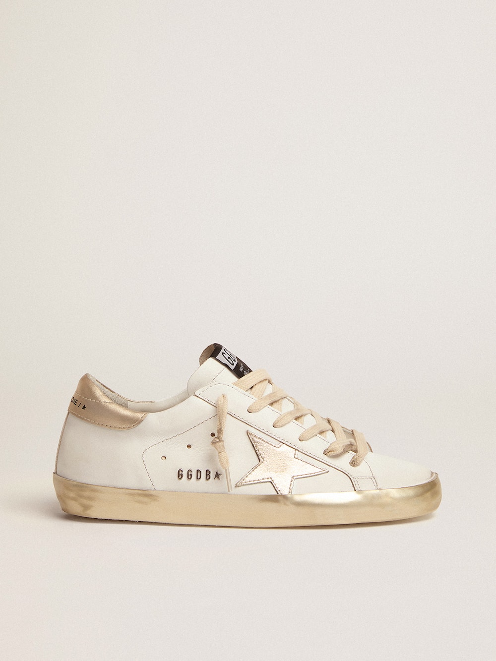 Golden Goose - Women's Super-Star with gold sparkle foxing and metal stud lettering in 