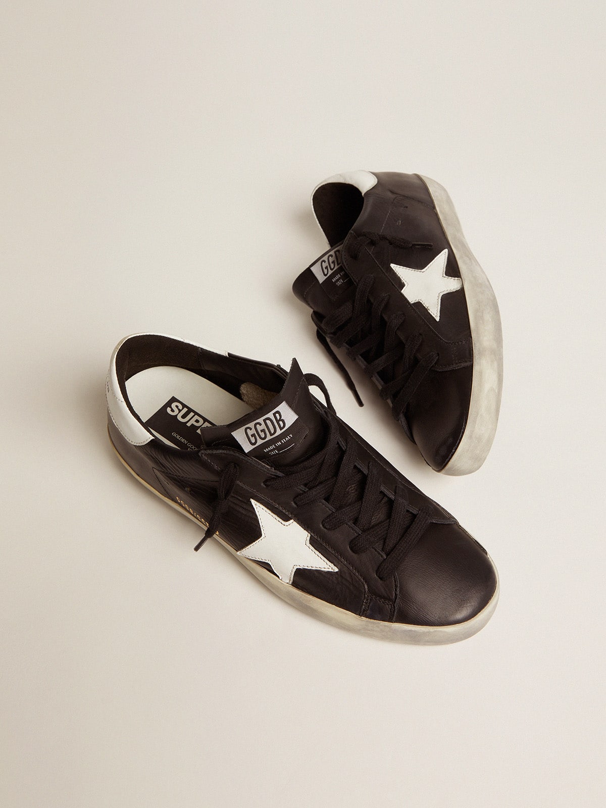 Golden Goose - Women’s Super-Star in black leather with white leather star and heel tab in 