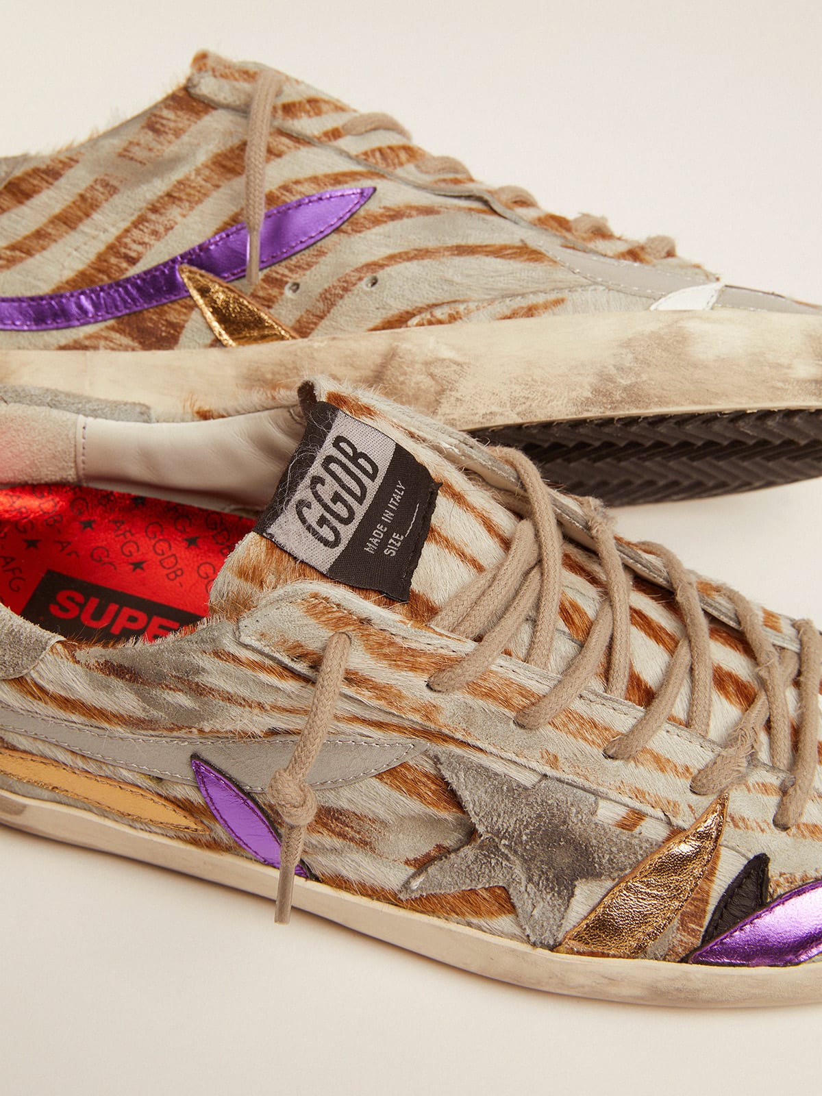 Super-Star sneakers in zebra-print pony skin with colored laminated leather  petals