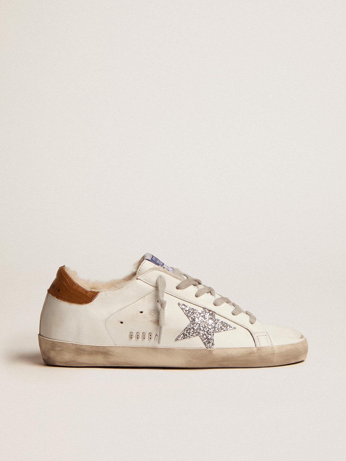 Women s Super Star with shearling lining and silver glitter star Golden Goose