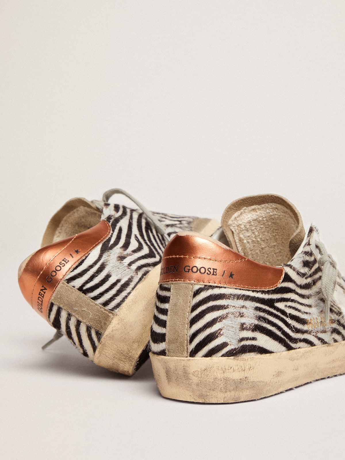 Golden Goose - Women's Super-Star LTD in zebra print pony skin with white star in 