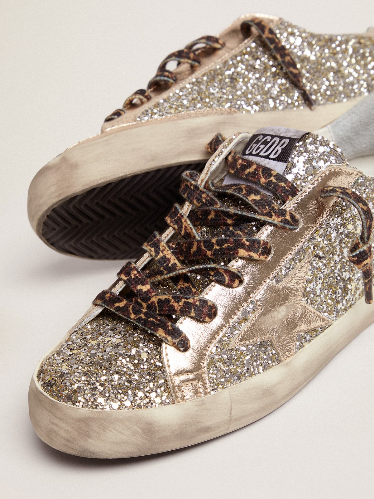 Golden Goose - Women's Super-Star in platinum glitter with leather star and heel tab in 