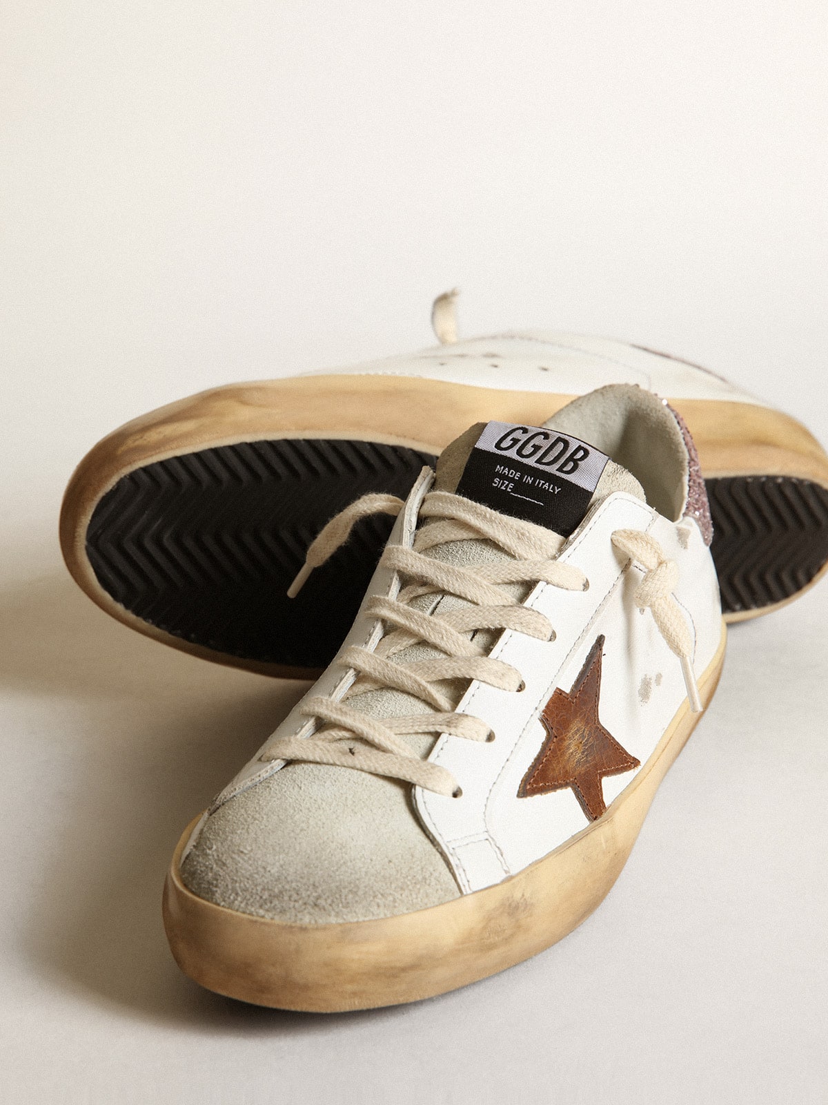 Super-Star with a tan star and pink glitter heel tab | Golden Goose