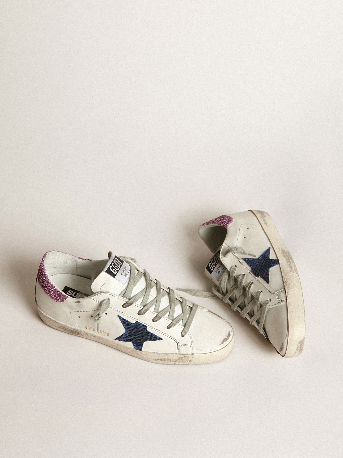 Golden Goose - White Super-Star sneakers with blue star and glittery heel tab in 