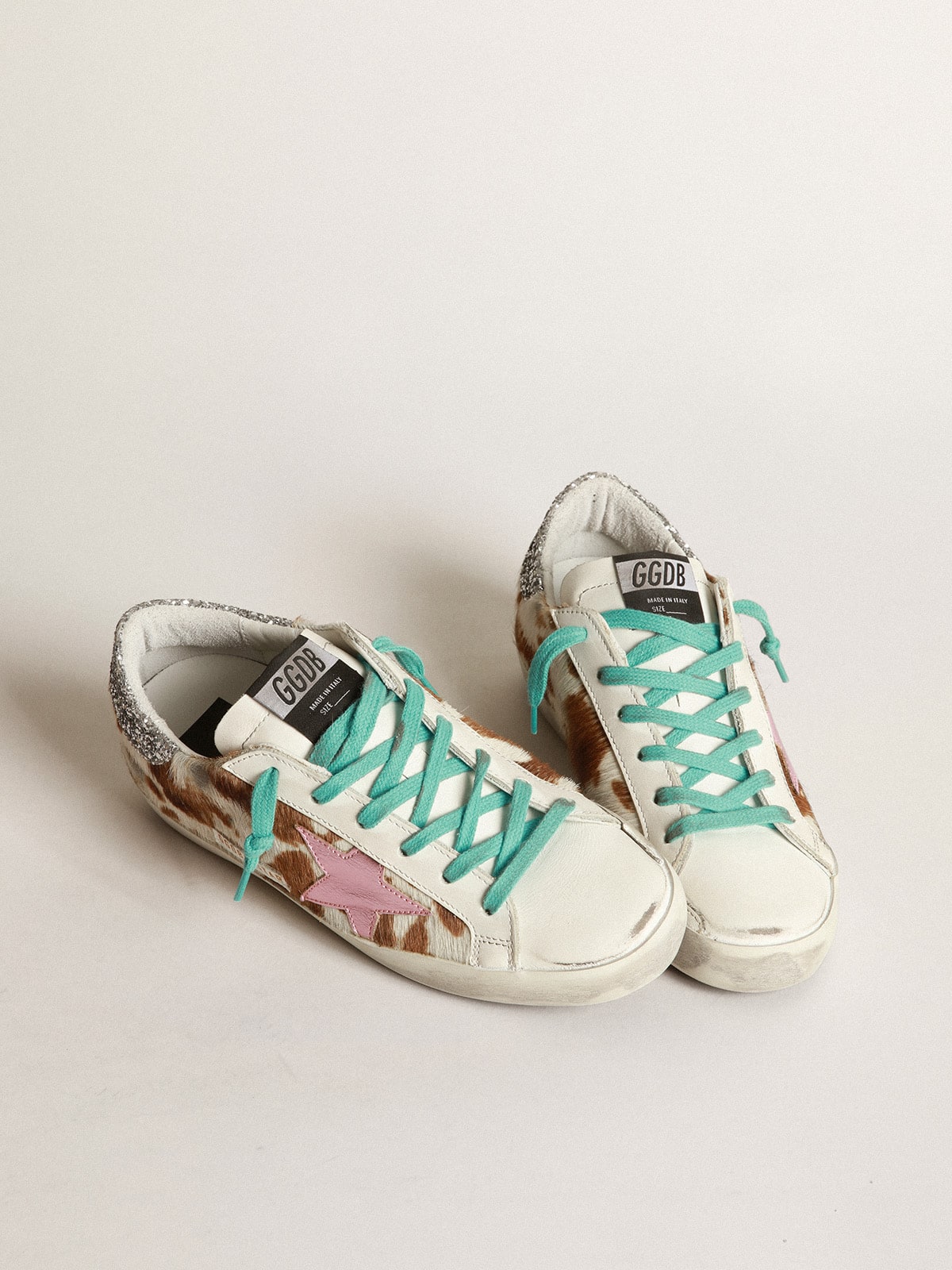 Golden Goose - Cow-print Super-Star sneakers with glittery heel tab     in 