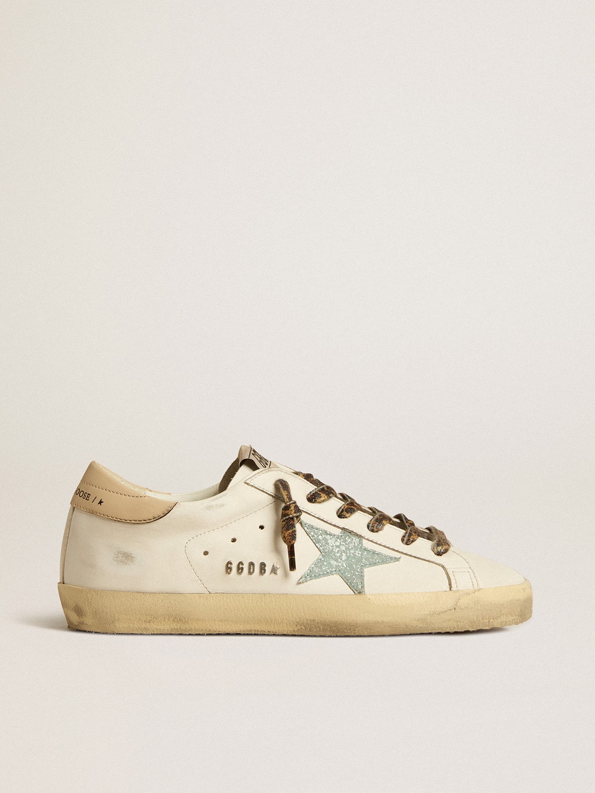 Golden Goose - Women's Super-Star with gray glitter star and nude leather heel tab in 