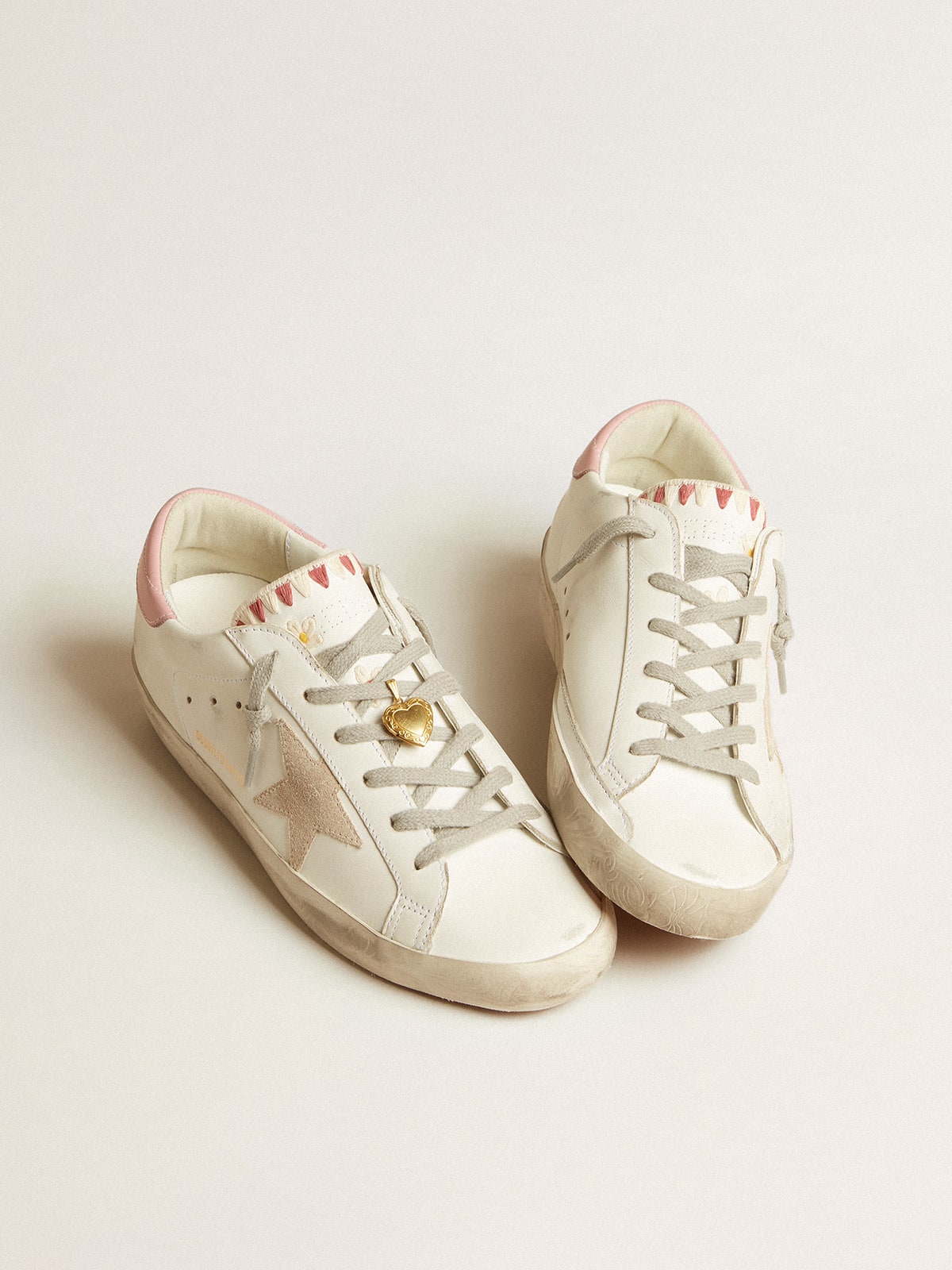 Super-Star LTD with beige suede star and pink heel tab | Golden Goose