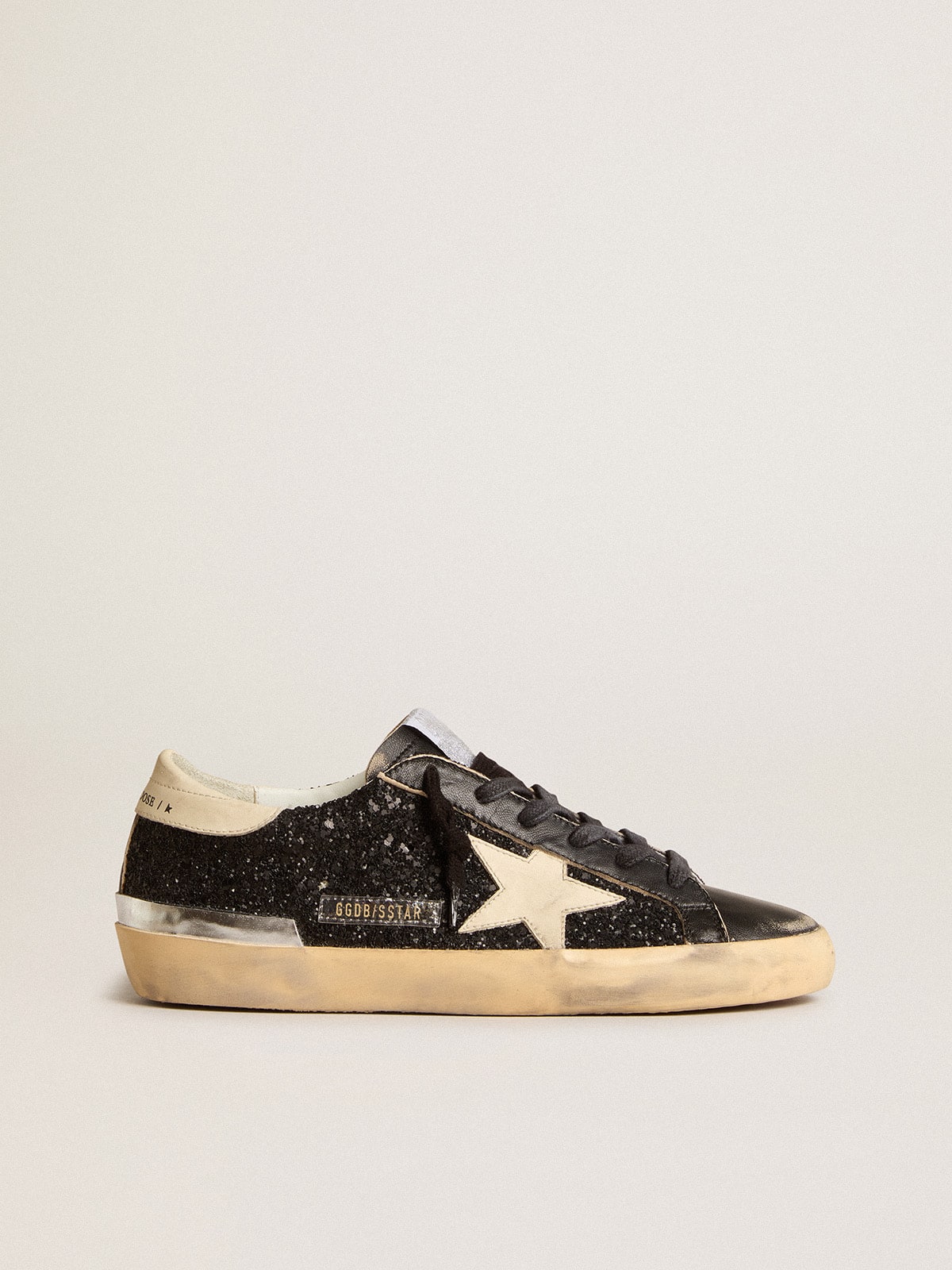 Women s Super Star in black glitter and nappa with cream leather star and heel tab Golden Goose