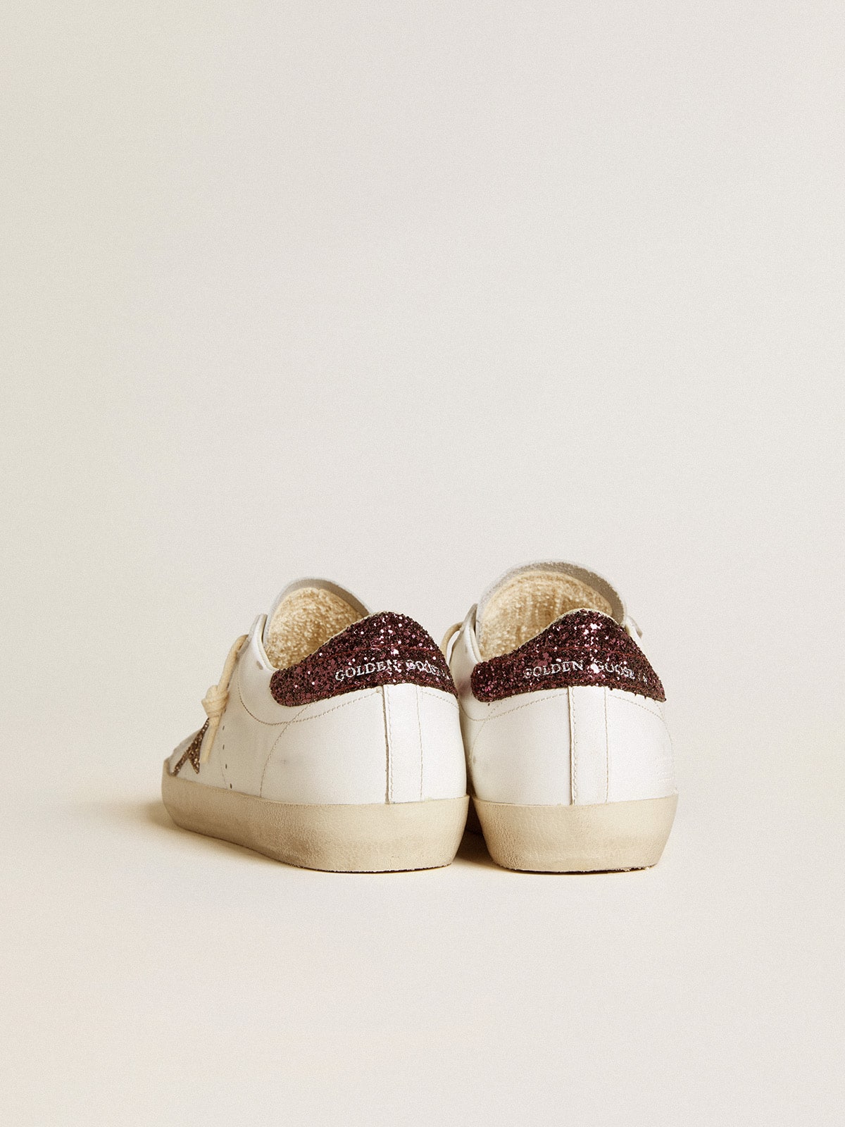 Golden Goose - Women's Super-Star with gold glitter star and burgundy glitter heel tab in 