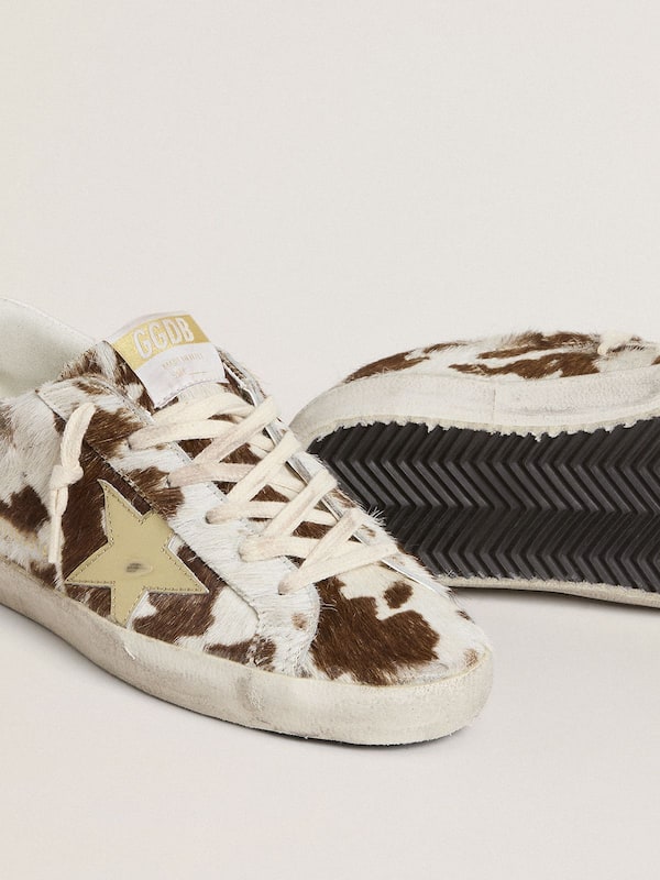 Golden Goose - Women’s Super-Star in animal-print pony skin with gold metallic leather star  in 