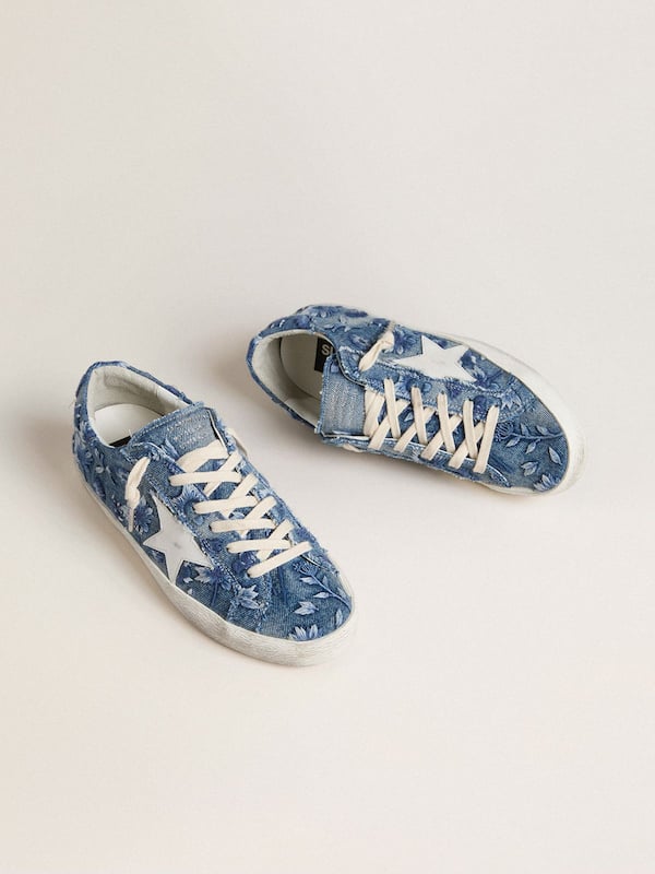 Women's Super-Star LTD in light blue denim with a white leather star and embroidered flowers
