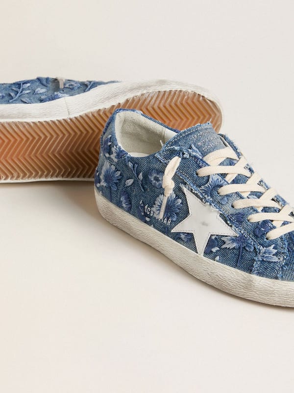 Women's Super-Star LTD in light blue denim with a white leather star and embroidered flowers