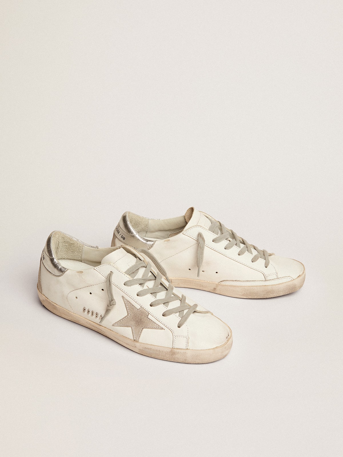 Women s Super Star with silver heel tab and metal stud lettering Golden Goose