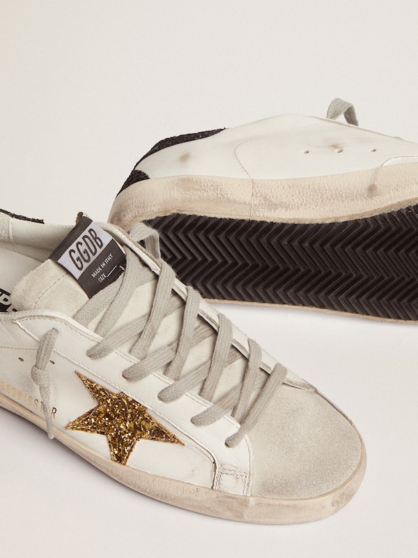 Golden Goose - Women's Super-Star LTD with gold star and black glitter heel tab in 