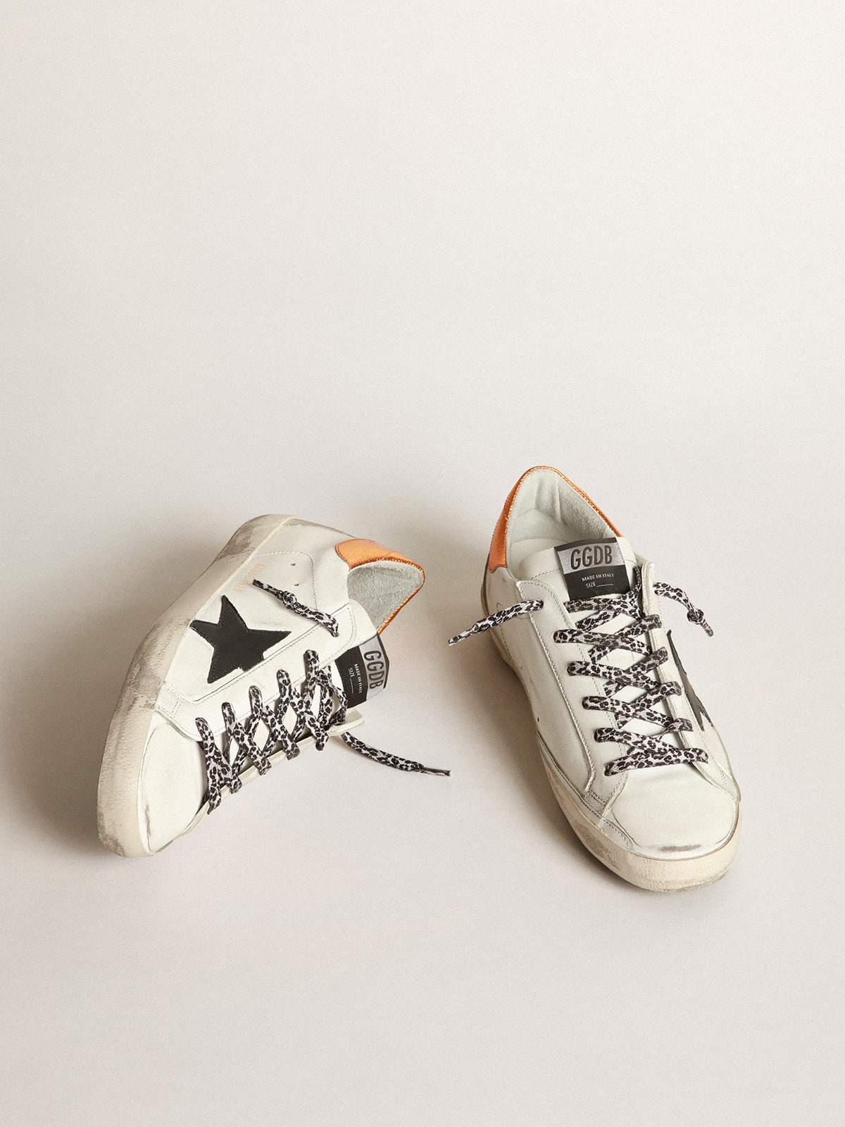 Golden Goose - White Super-Star sneakers with black star and leopard-print laces in 