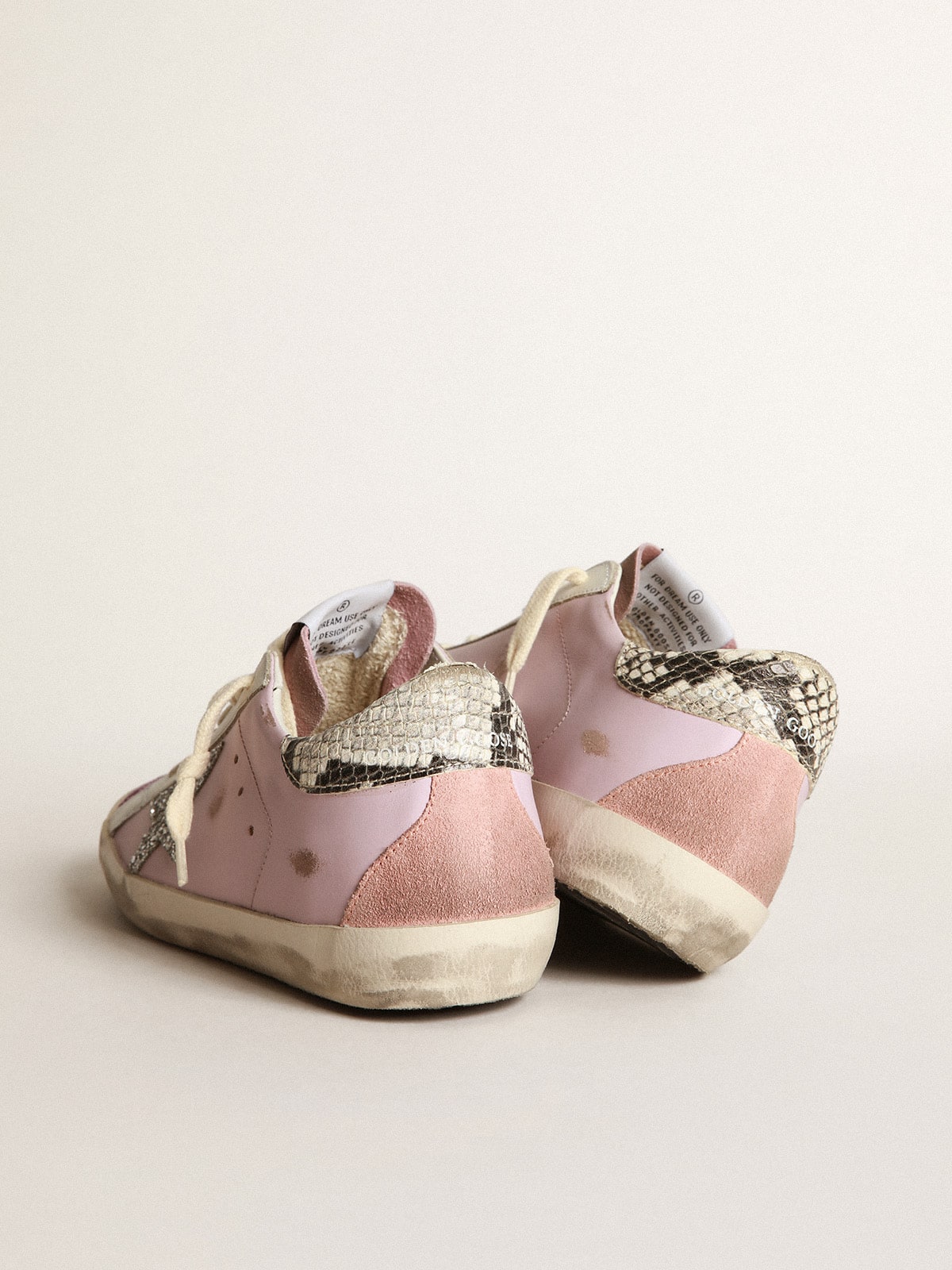 Golden Goose - Sneaker Super-Star in pelle rosa con stella in glitter argento e talloncino in pelle con stampa pitonata in 