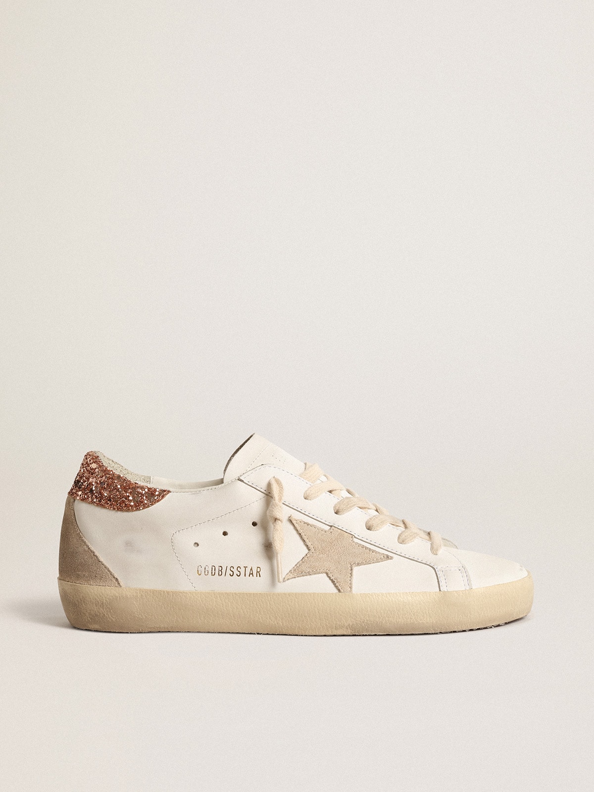 Women s Super Star with a suede star and peach pink glitter heel tab Golden Goose