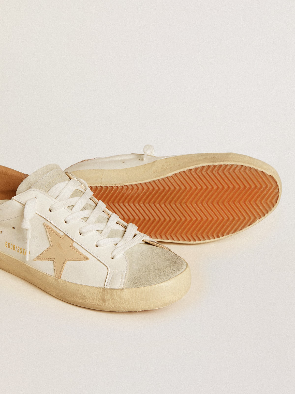 Golden Goose - Super-Star with nude leather star and gold glitter heel tab in 