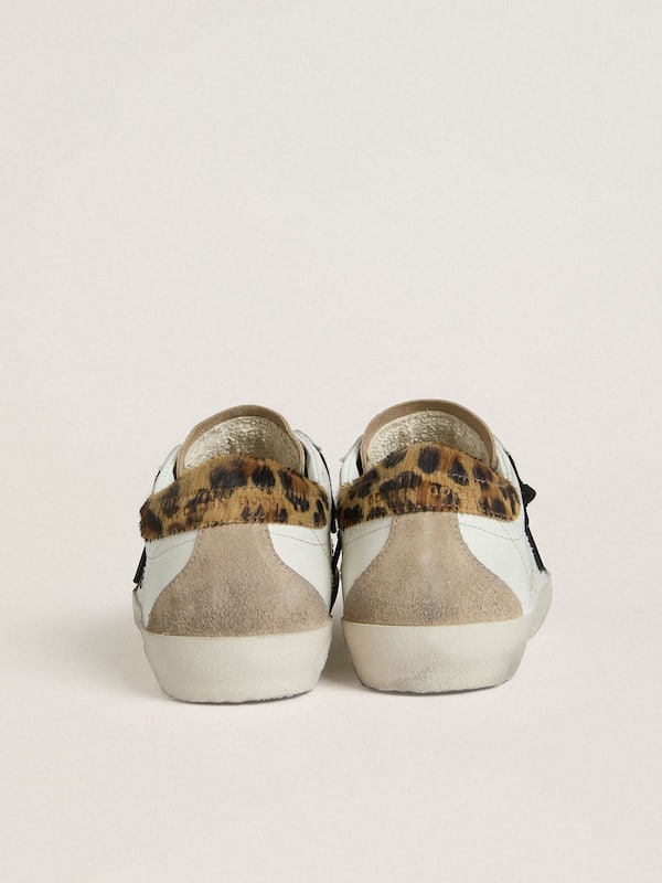 Golden Goose - Women's Super-Star with black glitter star and leopard-print pony skin heel tab in 
