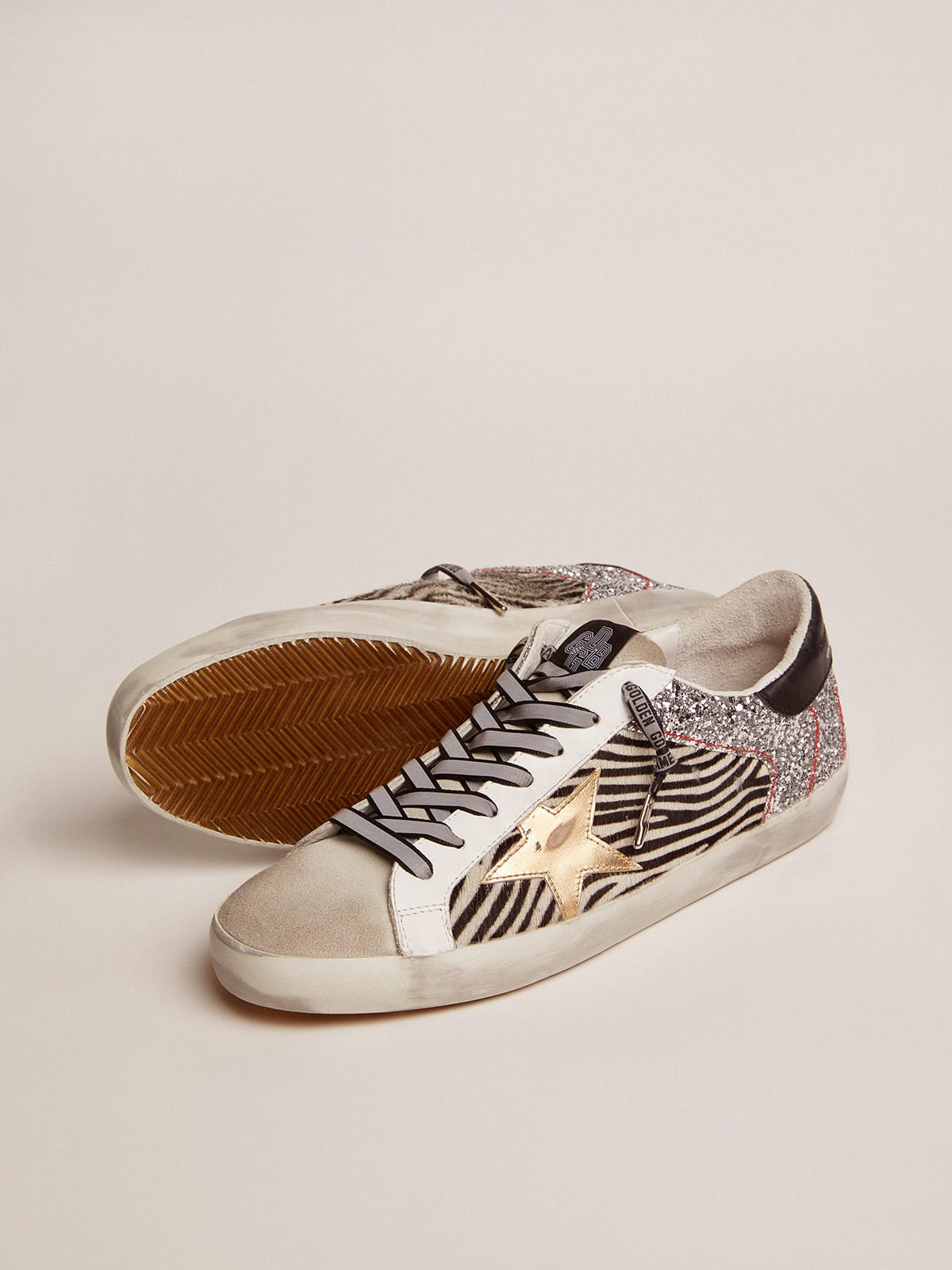 Golden Goose - Super-Star feminino de couro cavalinho zebrado e glitter prateado in 