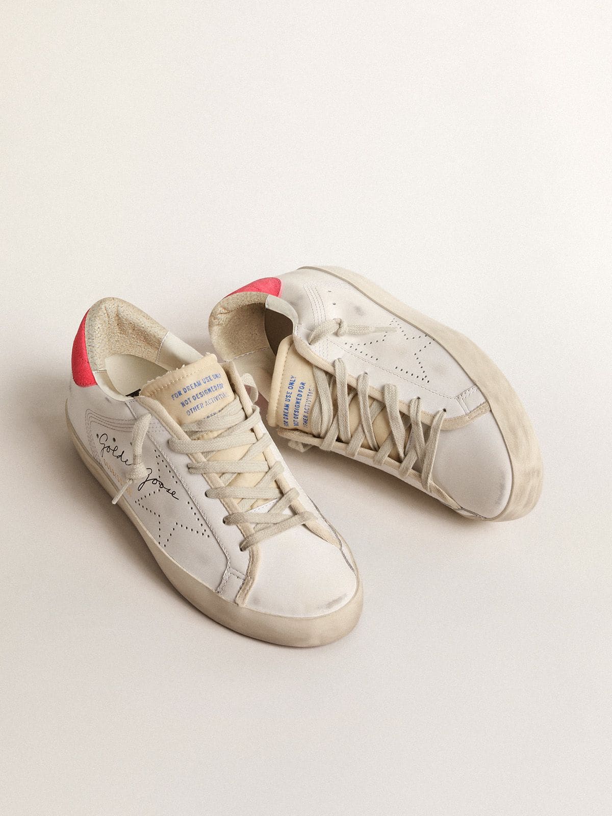 Women's white leather Super-Star with perforated star and fuchsia nylon heel tab