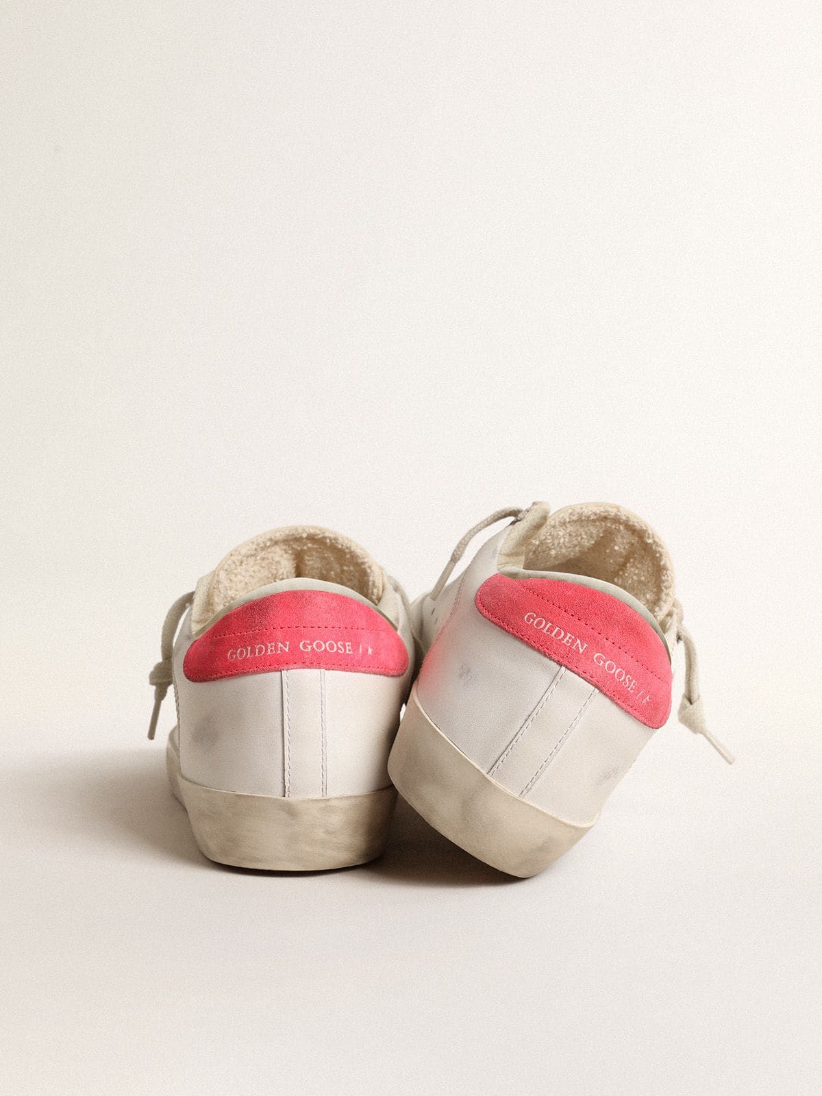 Golden Goose - Women's white leather Super-Star with perforated star and fuchsia nylon heel tab in 
