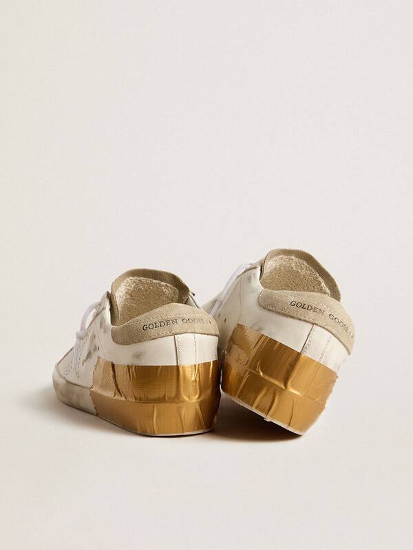 Golden Goose - Women's Super-Star LTD in white leather with ice-gray suede inserts and gold-colored tape in 
