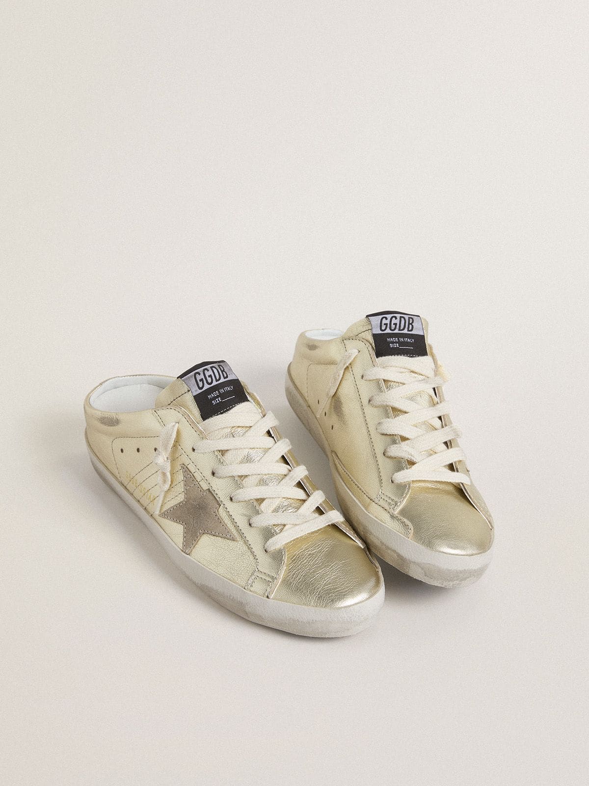 Golden Goose - Super-Star Sabots in platinum foiled leather with beige suede star   in 