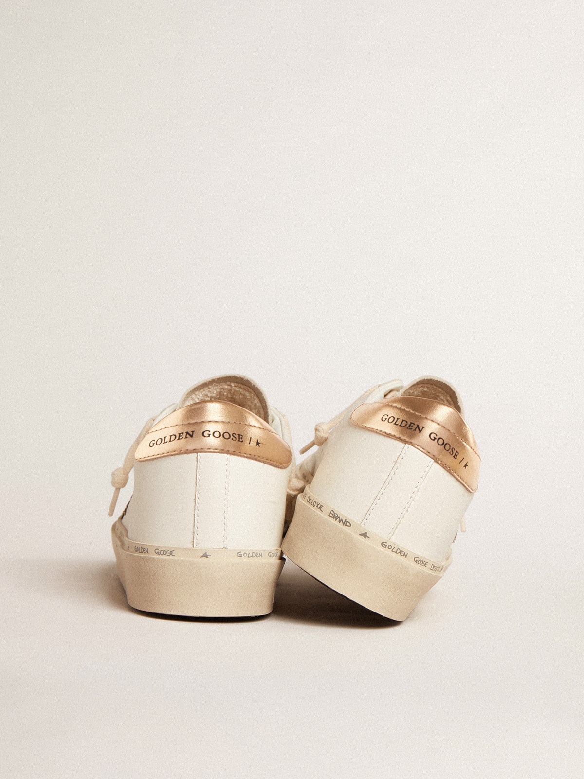 Golden Goose - Hi Star LTD with black and gold glitter star and gold heel tab in 