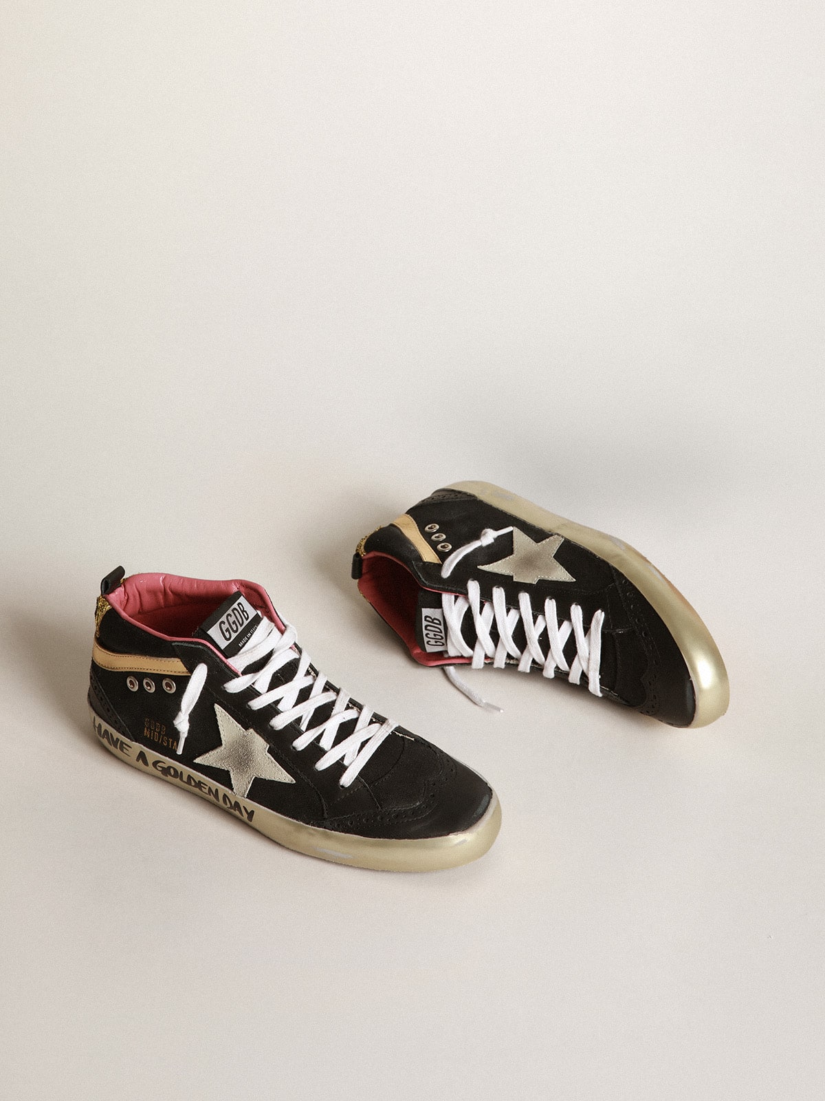 Golden Goose - Black Mid-Star sneakers with gold-coloured inserts and glitter in 